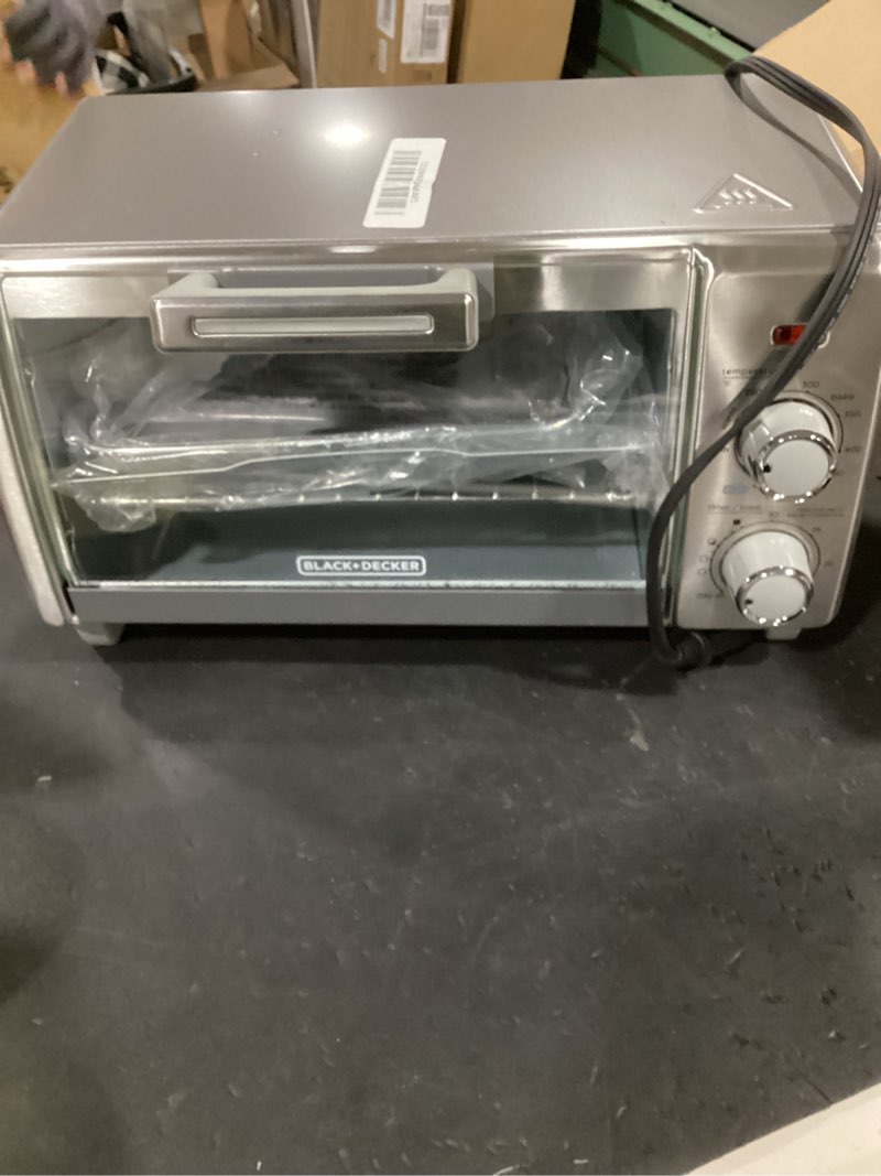 Condition photo showing As Is for black+decker crisp 'n bake air fry countertop convection toaster oven, medium capacity, 4-slice, 5-in-1, fits 9” pizza, 30-min timer, bake, broil, air fry, toast, keep warm, stainless steel