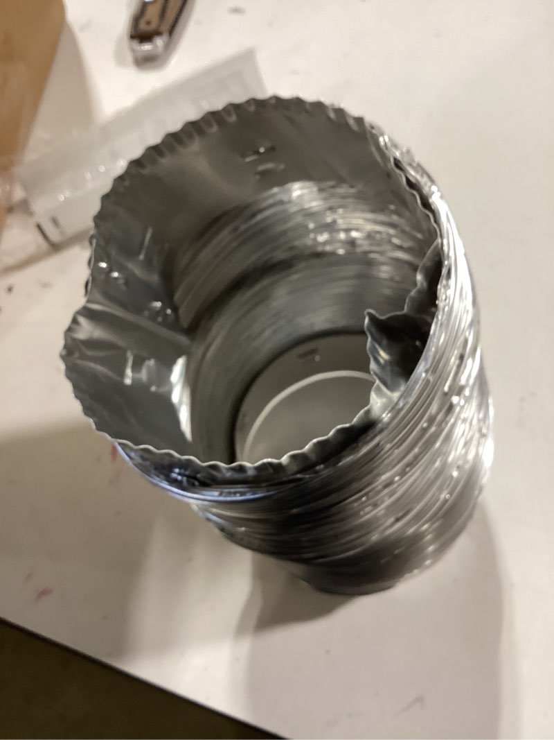 Condition photo showing As Is for lambro rigiflex semi-rigid silver flexible duct with quick connect collars for laundry closet installations