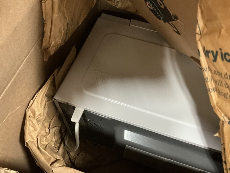 Condition photo showing As Is for Farberware 0.9 Cu. Ft. Countertop Microwave Oven – 900W Power, Auto Cook Settings, Defrost, and Safety Lock – White 0.9 Cu. Ft White