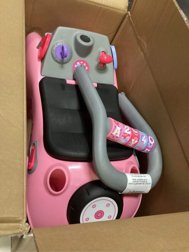 Condition photo showing Good Condition for radio flyer creativity car, for toddlers 1-3, 3-in-1 push walker ride on rocket with 17 sensory activities, anti-tip feature, under-seat storage, horn and gears, 42 lb capacity, toddler ride on toys pink