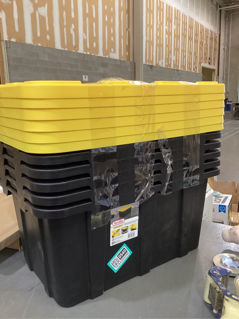 Condition photo showing Good Condition for sterilite 17 gal industrial tote, stackable storage bin with snap-fit lid for garage, basement & attic storage, black base and yellow lily lid, 6-pack 17 gallon
