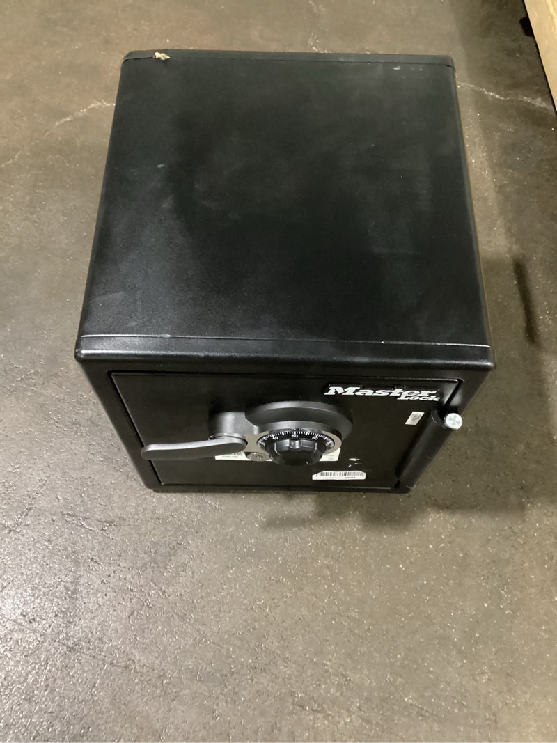Condition photo showing As Is for master lock black premium fireproof and waterproof safe with combination dial, 1.23 cu-ft, stw123dub 1.23 cu.ft. 2-hr. fireproof, combination