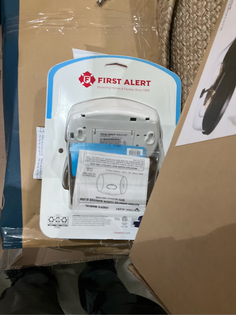 Condition photo showing As Is for carbon monoxide alarm