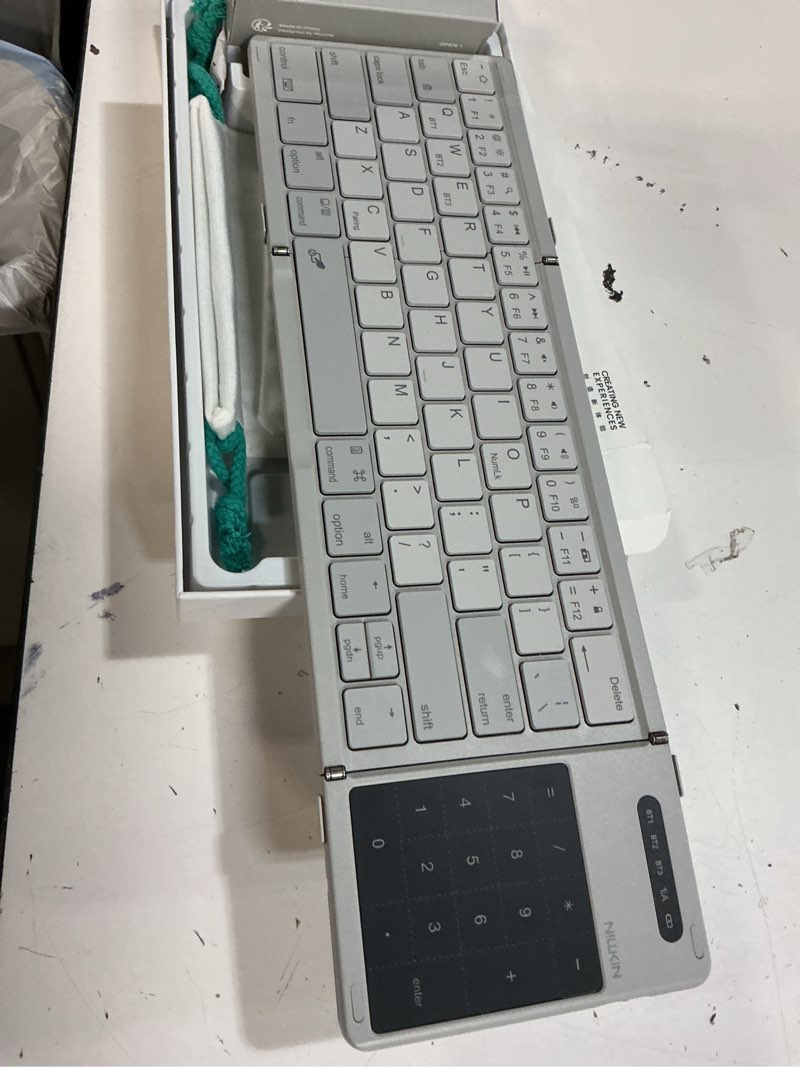 Condition photo showing New/Like New for nillkin upgraded foldable bluetooth keyboard with touchpad & number pad, portable wireless keyboard for travel, pocket-sized, full size keys, support 3 devices for ipad laptop tablets phone, gray