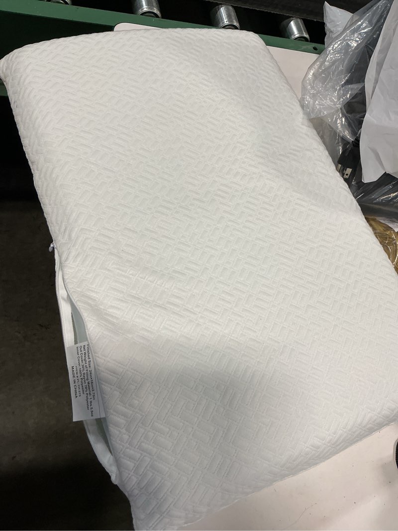 Condition photo showing Good Condition for 24in x 16in x 2.75in memory foam pillow with textured cover and side zipper