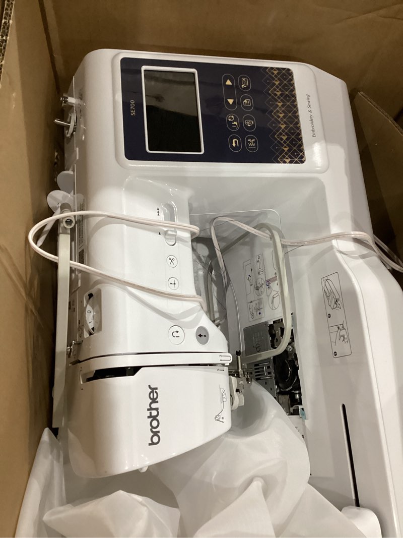 Condition photo showing As Is for Brother SE700 Sewing and Embroidery Machine, Wireless LAN Connected, 135 Built-in Designs, 103 Built-in Stitches, Computerized, 4" x 4" Hoop Area, 3.7" Touchscreen Display, 8 Included Feet, White 16"x7"x12