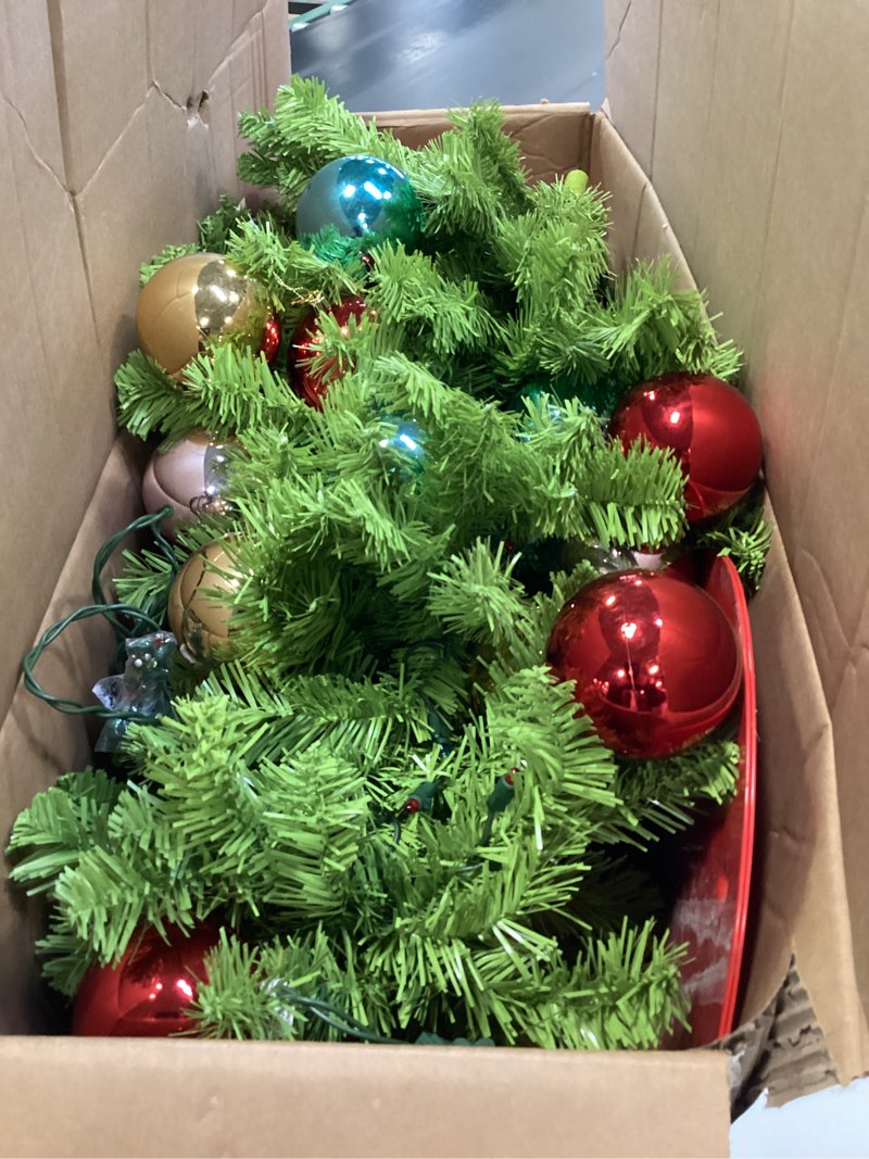 Condition photo showing As Is for Christmas Tree 6FT with Flexible Branches - Whimsical Design Perfect for Yard, Includes Sturdy Stand for Outdoor & Indoor