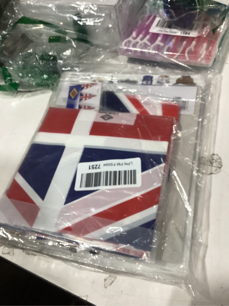 Condition photo showing New/Like New for celebrate in british style with our 30-piece uk party decorations bundle - table cover, banner, door cover, photo fun signs, and dangling whirls for the ultimate united kingdom bash!