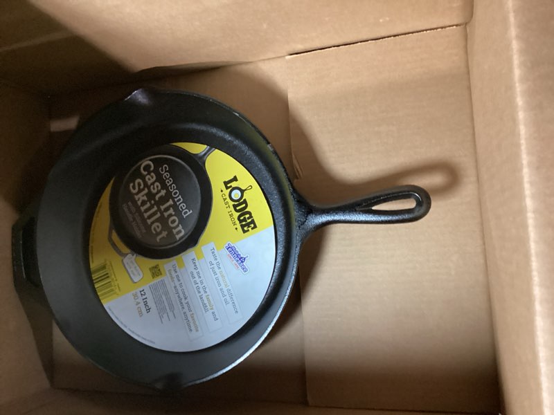 Condition photo showing New/Like New for Lodge 12 Inch Cast Iron Skillet with Red Silicone Hot Handle Holder – Pre-Seasoned Frying Pan for Stove, Oven, Grill & Campfire – Made in the USA – Durable, Nonstick Cast Iron Cookware – Black 12 inch + Hot Handle Holder