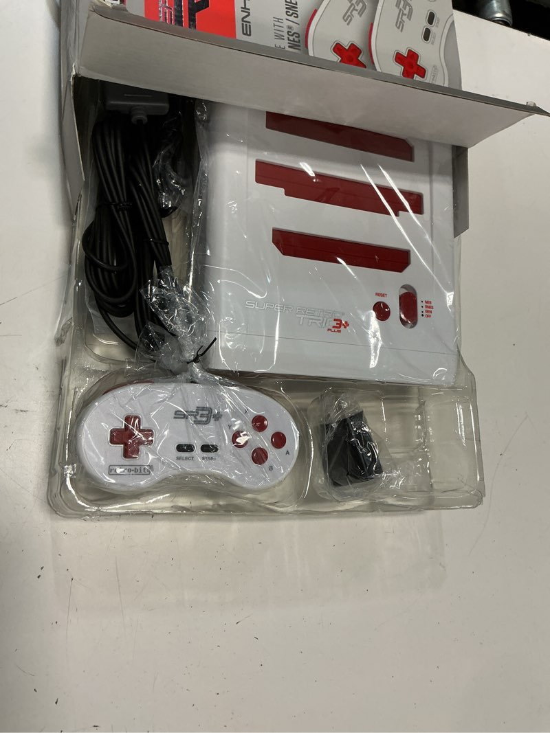 Condition photo showing New/Like New for retro-bit super retro trio hd plus 720p 3 in 1 console system - hdmi port - for original nes/snes, super nintendo and sega genesis games - red/white