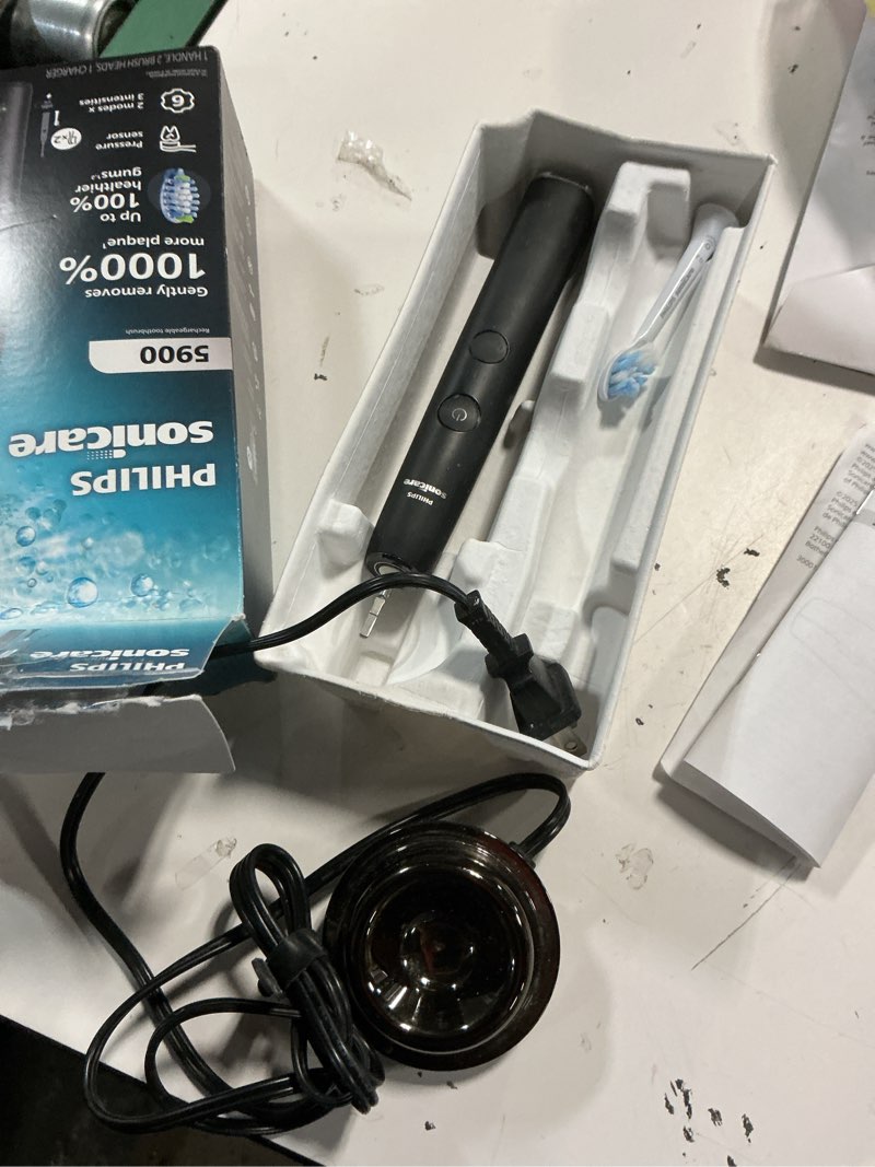 Condition photo showing As Is for philips sonicare 5900 series electric toothbrush, pressure sensor, 6 brushing settings, smartimer, brushpacer, 21-day runtime, gentle professional-clean feel, for sensitive gums, black, hx7131/02