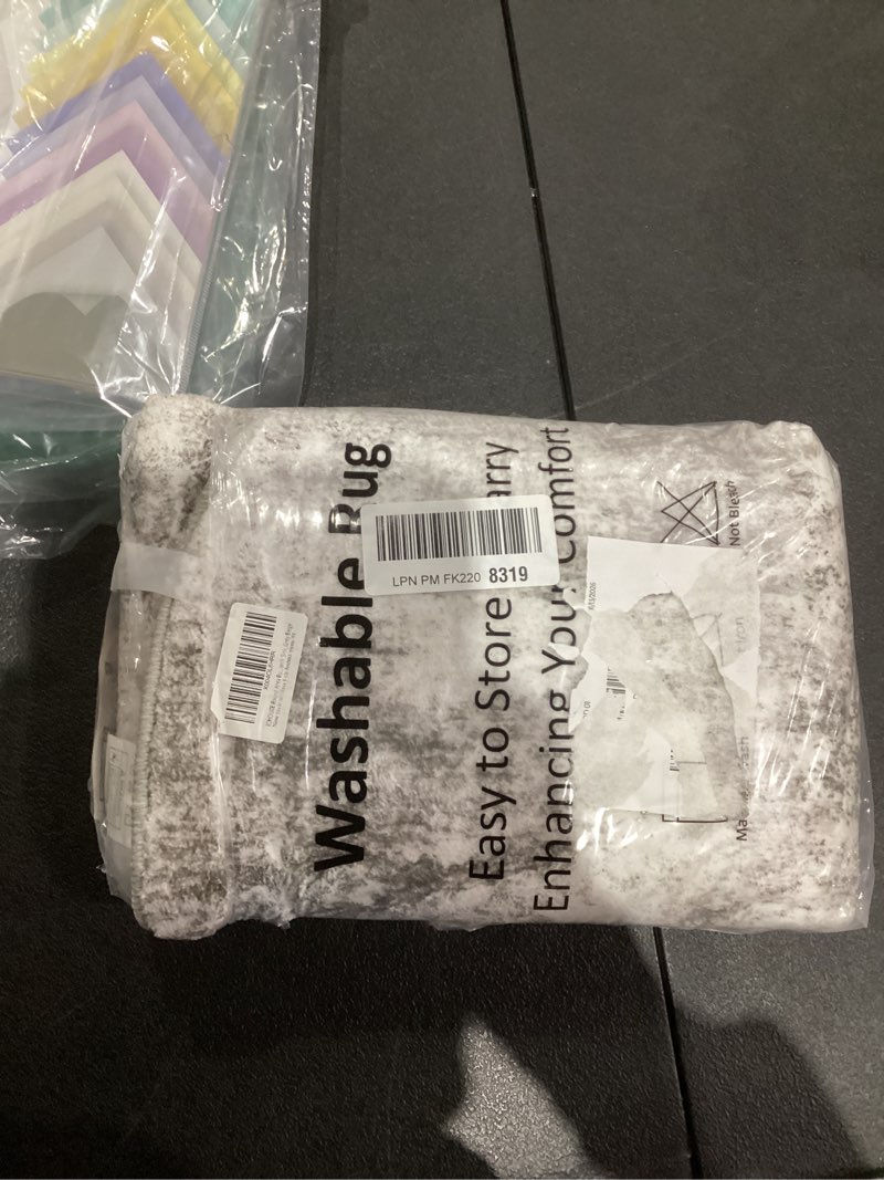 Condition photo showing As Is for IOHOUZE Round Area Rug 3 Ft Circle Entryway Rugs Round Washable Door Mat Indoor Entrance, Non Slip Circle Front Door Rug, Printed Abstract Faux Wool Floor Carpet for Foyer Porch Sink, Grey Beige 3' (Round) Ash Grey/Beige