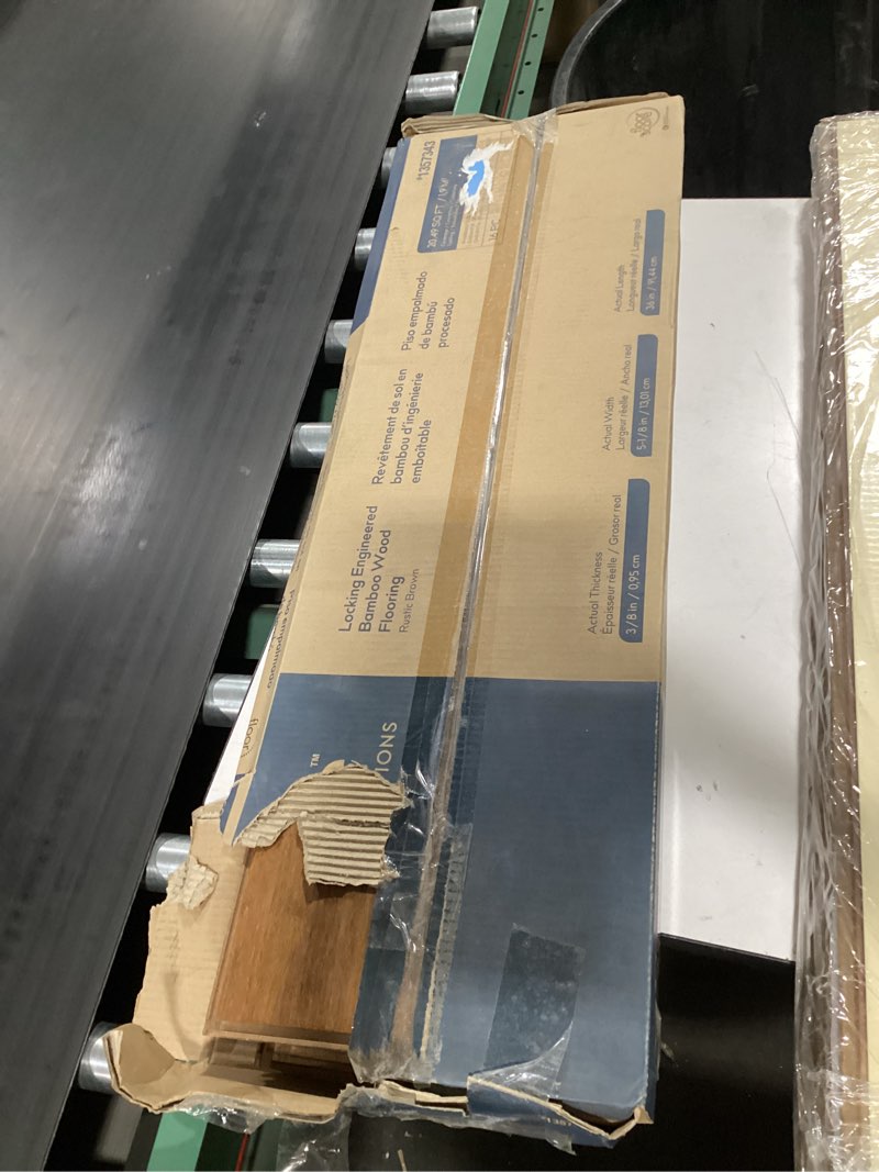 Condition photo showing As Is for Style Selections Rustic Brown Bamboo 5-1/8-in Wide x 3/8-in Thick Handscraped Engineered Hardwood Flooring (20.49-sq ft)