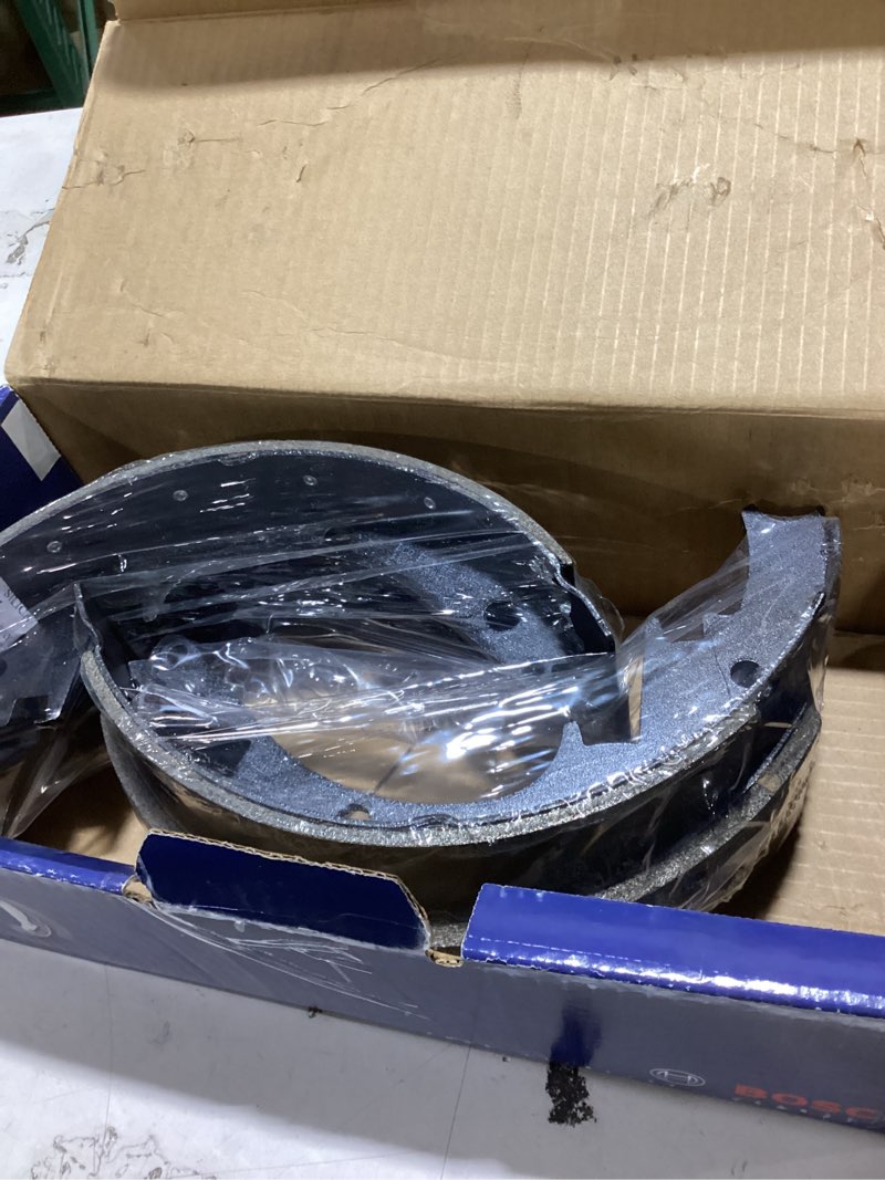 Condition photo showing As Is for bosch bs473r blue drum brake shoe set for select full-size 1978-02 cadillac, chevrolet, and gmc trucks and suvs - rear (riveted)