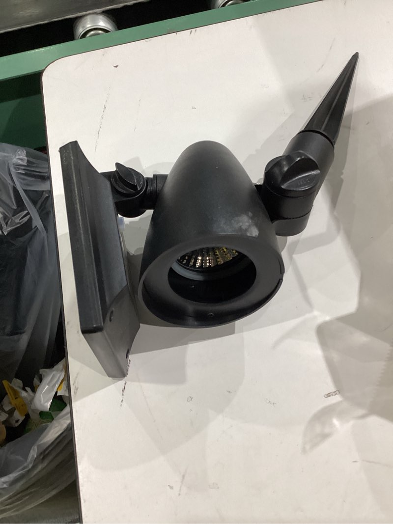 Condition photo showing As Is for harbor breeze 60 -lumens 1 -watt black solar led spot light