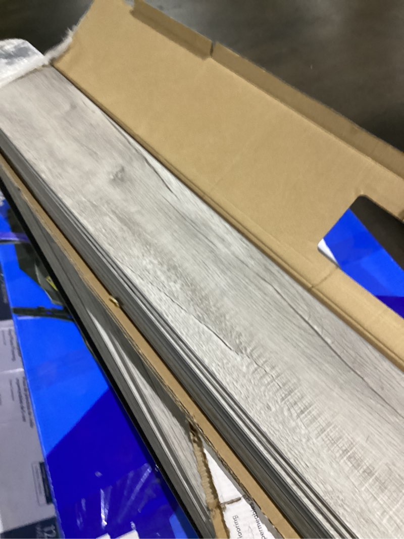 Condition photo showing As Is for procore plus charleston oak 7-in x 47.75-in waterproof interlocking luxury vinyl plank flooring (23.21-sq ft) 5 pack