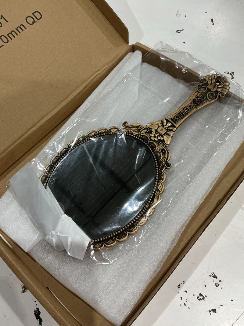 Condition photo showing Good Condition for uxcell 1 pcs vintage hand held mirror, embossed design portable hand vanity mirrors single side with hook hole for bedroom, bathroom, travel, & makeup use, bronze gold(oval) bronze gold 1
