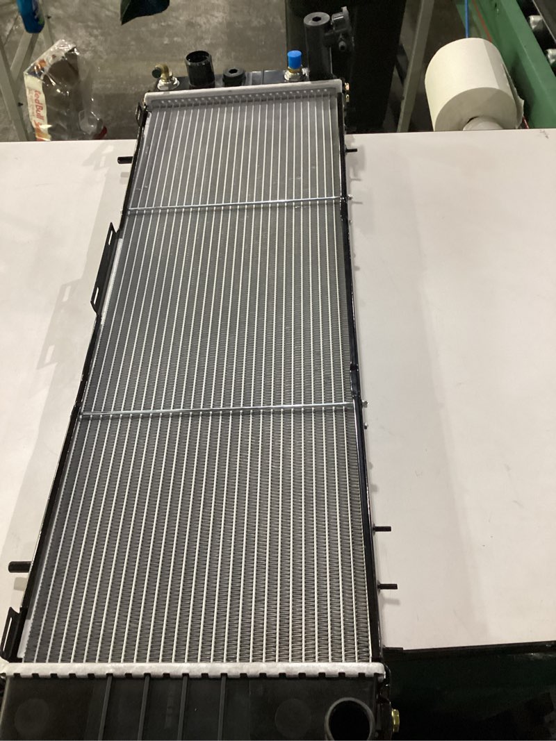 Condition photo showing As Is for *similar to stock* aluminum core radiator plastic tank radiador cu1193 for 1991-2001 jeep cherokee comanche xj 2.5l 4.0l at mt