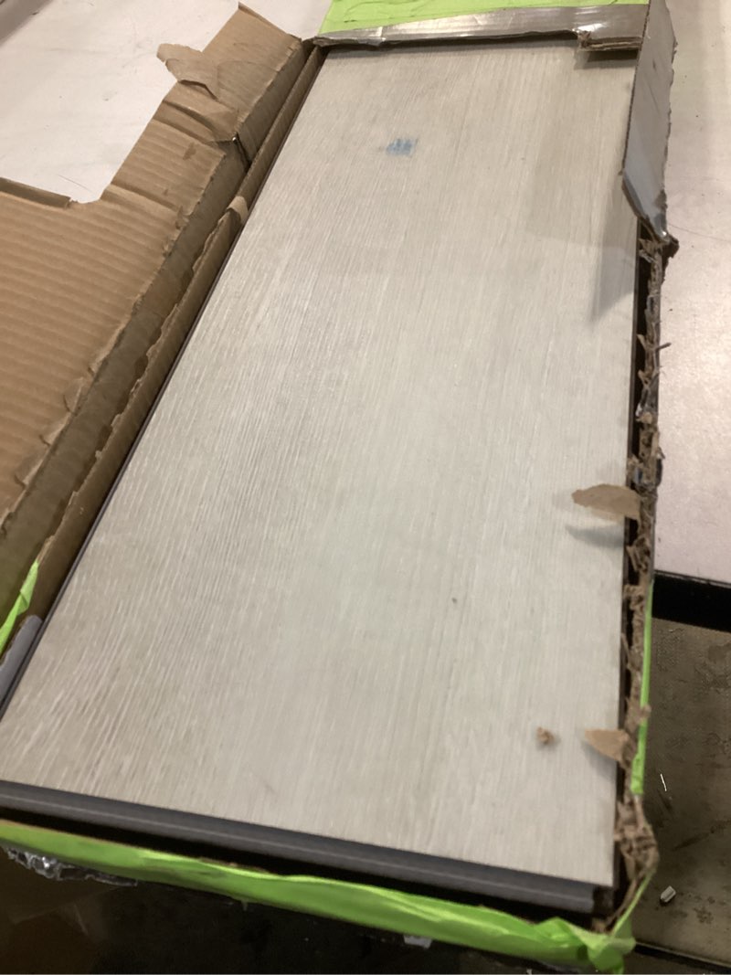 Condition photo showing As Is for STAINMASTER Seasalt 12-mil x 7-in W x 48-in L Waterproof Luxury Vinyl Plank Flooring 