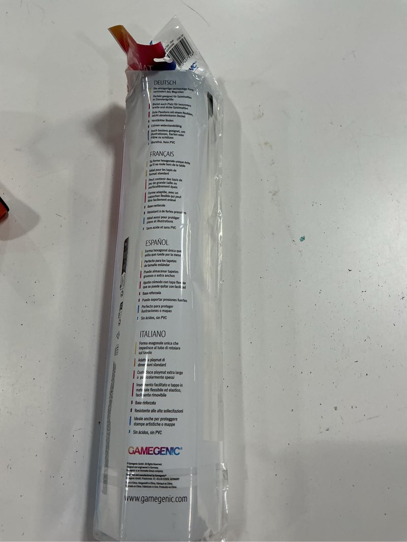 Condition photo showing New/Like New for gamegenic playmat tube | secure game mat storage | organizes and protects standard-sized and extra large playmats | unique hexagonal shape | semi-transparent clear color | made