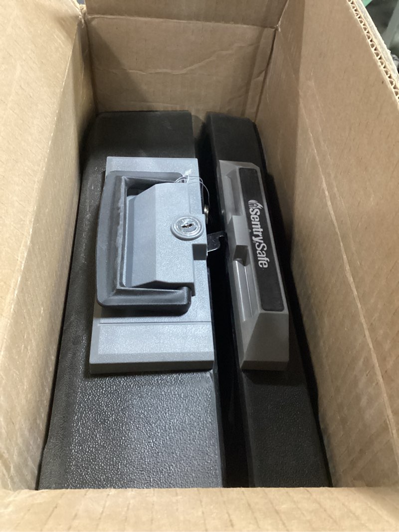 Condition photo showing As Is for sentrysafe fireproof safe box with key lock, chest safe with carrying handle to secure money, jewelry, documents, 0.25 cubic feet, 6.3 x 15.3 x 12.1 inches, 1160