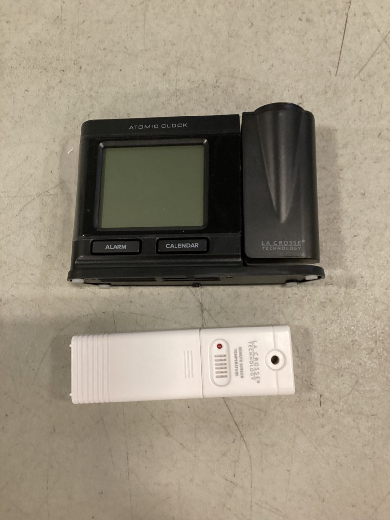 Condition photo showing New/Like New for black atomic projection alarm clock with temperature