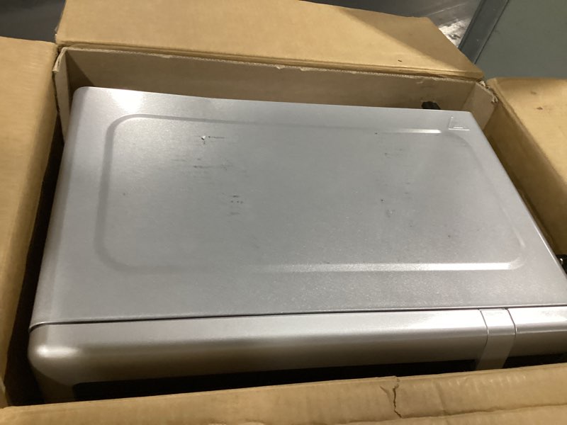 Condition photo showing Good Condition for Emerson MW7601SL Countertop Microwave Oven with Sleek Mirrored Finish Glass Door, 700W, 10 Power Levels and 6 Pre-Programmed Settings with Child Safe Lock, 0.7. Cu. Ft., Silver 0.7 Cu. Ft.