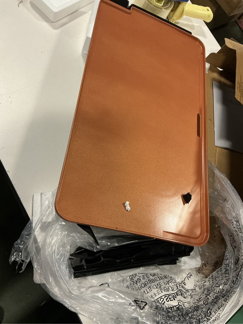 Condition photo showing As Is for BELLA XL Electric Ceramic Titanium Griddle, Make 15 Eggs At Once, Healthy-Eco Non-stick Coating, Hassle-Free Clean Up, Large Submersible Cooking Surface, 12" x 22", Copper/Black 12" x 22" Copper