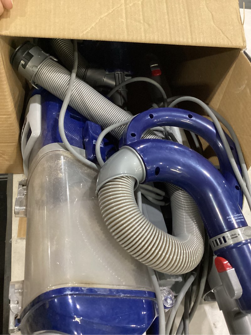 Condition photo showing As Is for *not tested/used* shark upright vacuum, navigator lift-away deluxe with large dust cup capacity, hepa filter, swivel steering, upholstery tool & crevice tool, blue, nv360 navigator (navy)