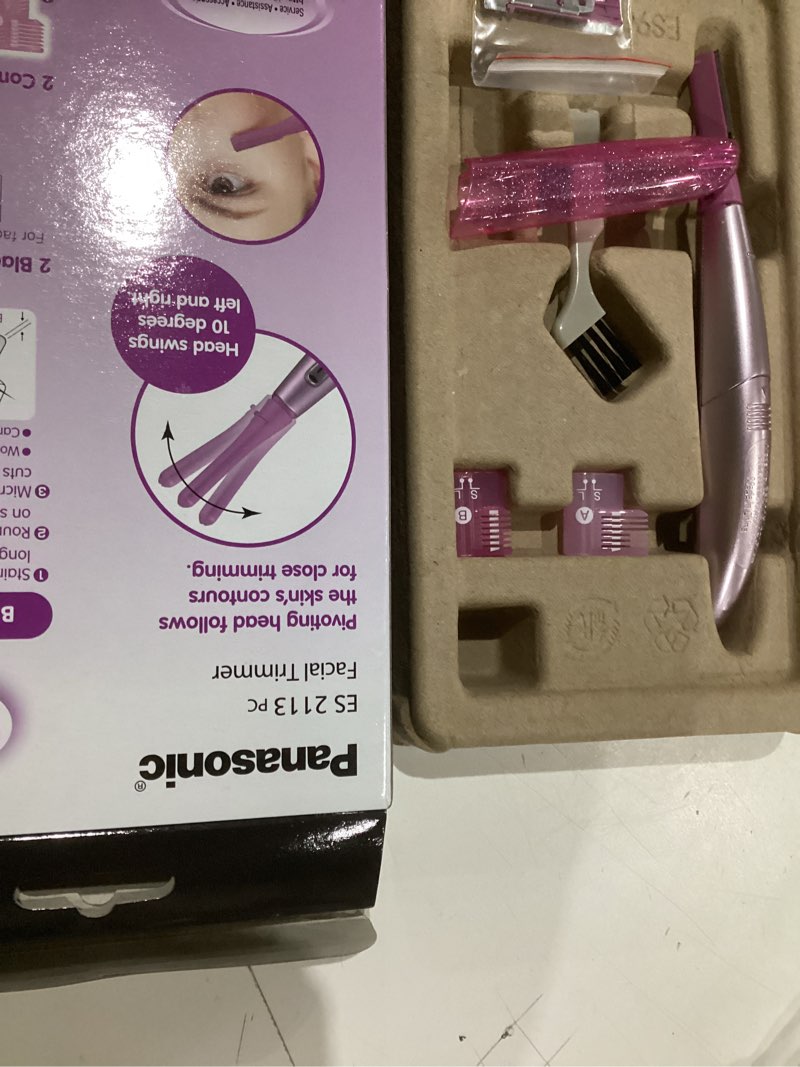 Condition photo showing As Is for panasonic women’s facial hair remover and eyebrow trimmer with pivoting head, includes 2 gentle blades for brow and face and 2 eyebrow trim attachments, battery-operated – es2113pc pink 5 piece set