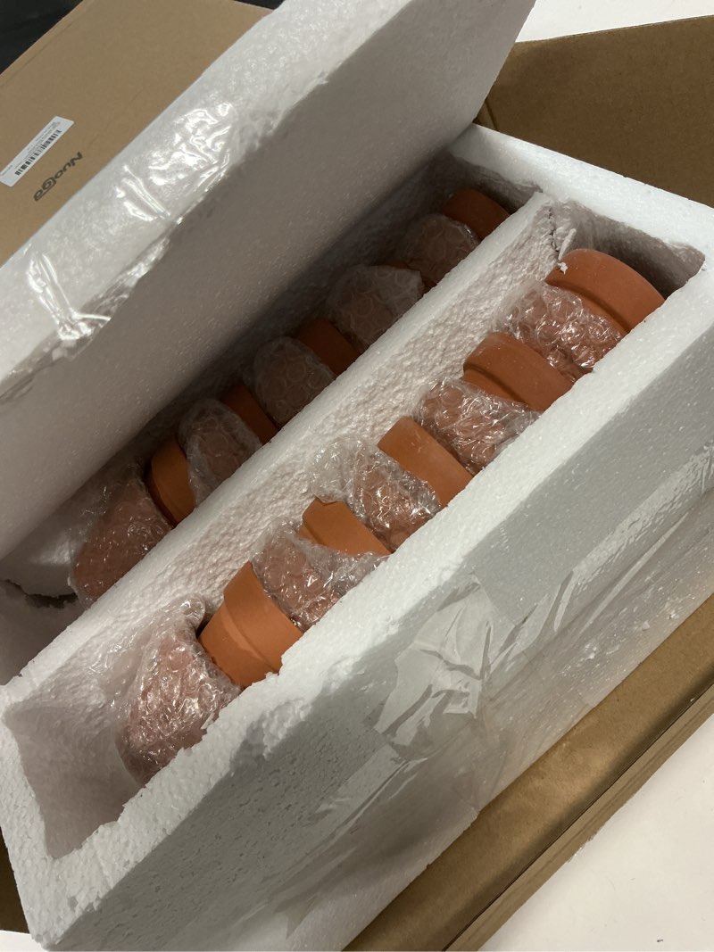Condition photo showing Good Condition for nuogo 100 pcs mini 2" terracotta pot bulk small plant pots, tiny clay pots nursery flower with drainage holes for indoor outdoor succulent cactus plants crafts wedding decorations