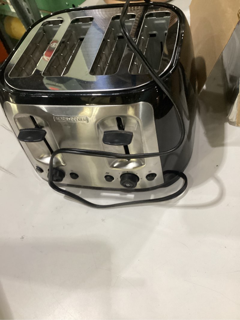 Condition photo showing As Is for black+decker 4-slice toaster, extra wide slots, 7 shade settings, 1400 watts, frozen and bagel buttons, toast shade selector, extra lift, not tested