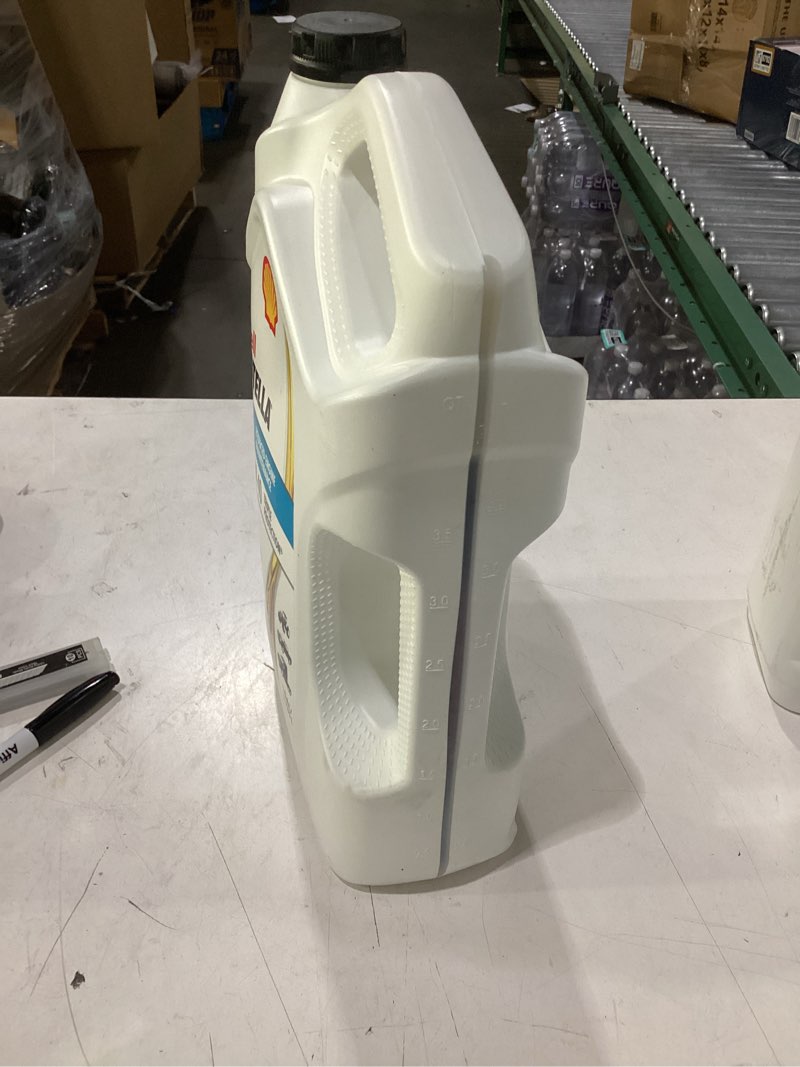 Condition photo showing New/Like New for shell rotella t4 triple protection 15w-40 diesel motor oil  1 gallon