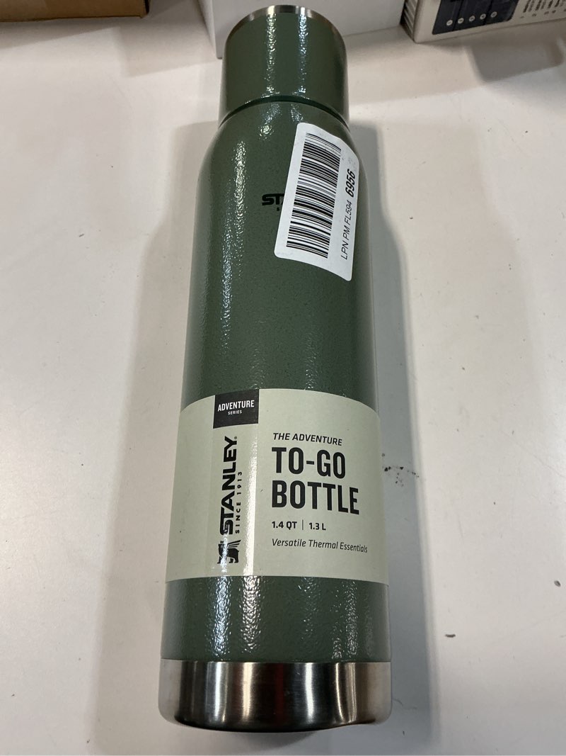 Condition photo showing New/Like New for Stanley Adventure-To-Go Vacuum Bottle 1.4 qt Wide Mouth with Leakproof Cup Lid Keep Drinks Hot or Cold Packable for Travel Insulated Stainless Steel Thermal Bottle BPA-Free Hammertone Green Hammertone Green 44.8 Ounces