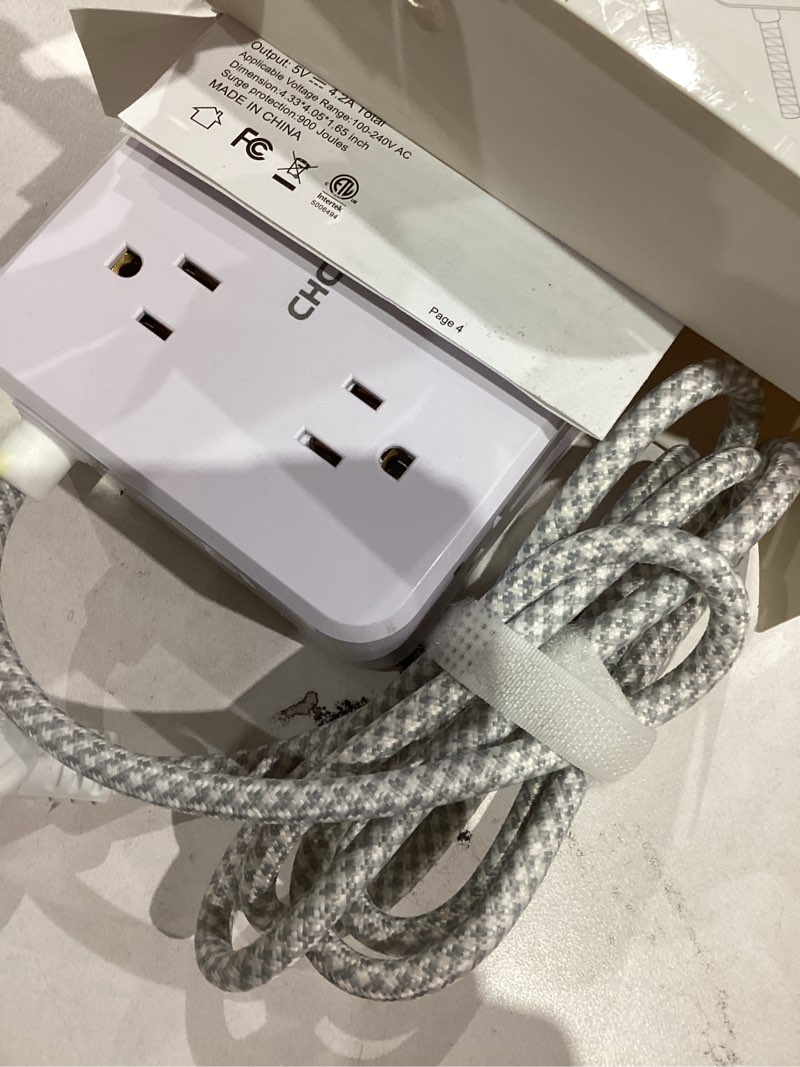 Condition photo showing As Is for Surge Protector Power Strip - CHCORE 5Ft Braided Extension Cord with 8 Outlets with 4 USB (2 USB C) Charging Ports, Flat Plug Multi Plug Outlet Extender Charging Station for Home Office, ETL, White 5Ft-Braided Cord White