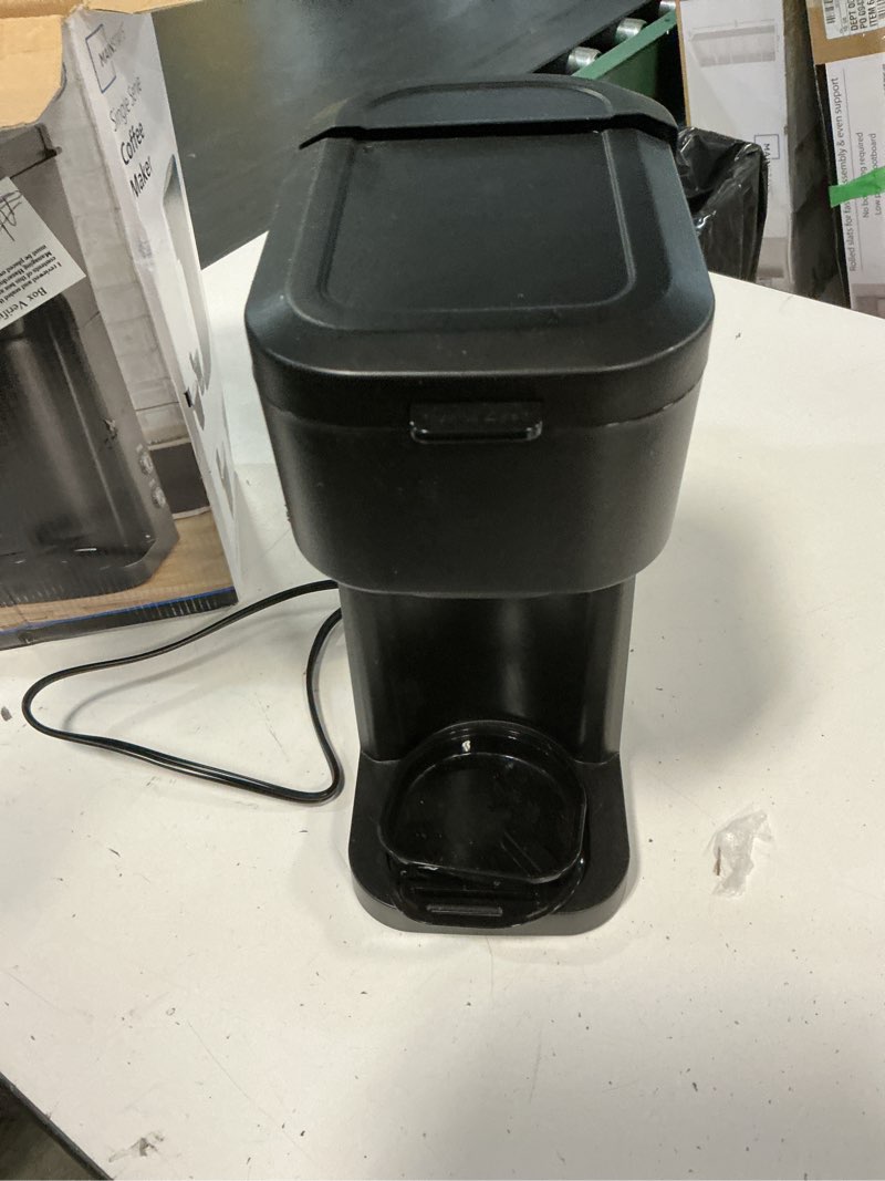 Condition photo showing As Is for mainstays black matte single serve coffee maker