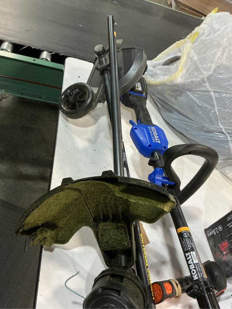 Condition photo showing As Is for kobalt 48v max (24vx2) 15-in attachment capable battery string trimmer kit, (2) 3.0ah batteries and charger included 6036647