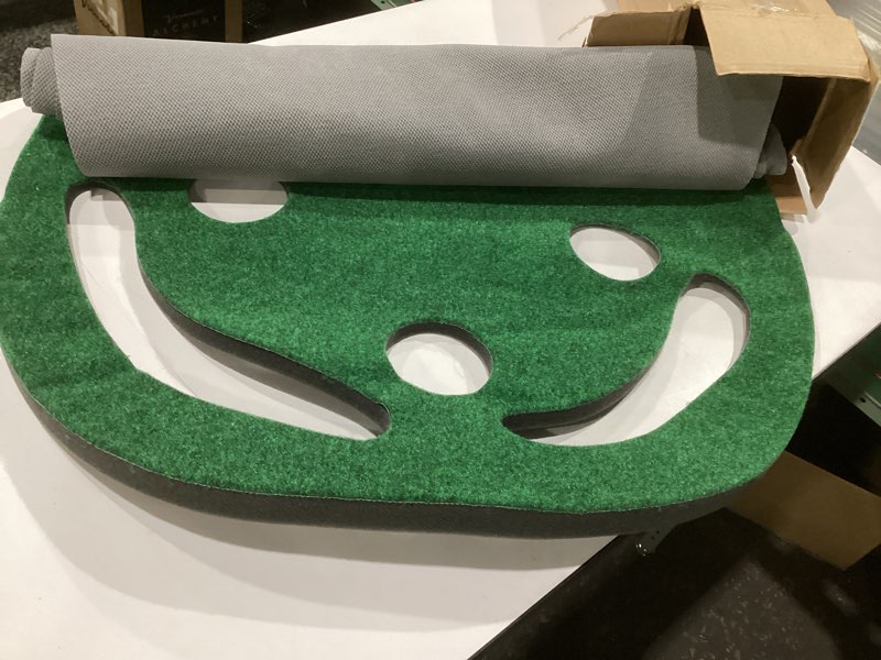 Condition photo showing As Is for amazon basics golf putting green 8'10" x 2'10" (l x w)