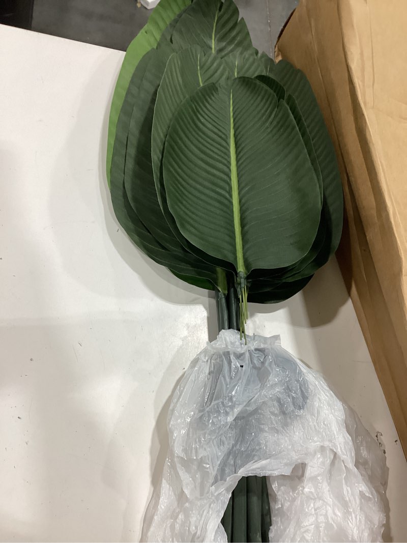 Condition photo showing As Is for artificial bird of paradise plants 5ft fake tropical palm tree with 10 trunks in pot and woven seagrass belly basket perfect faux plant for home indoor outdoor office modern decor green