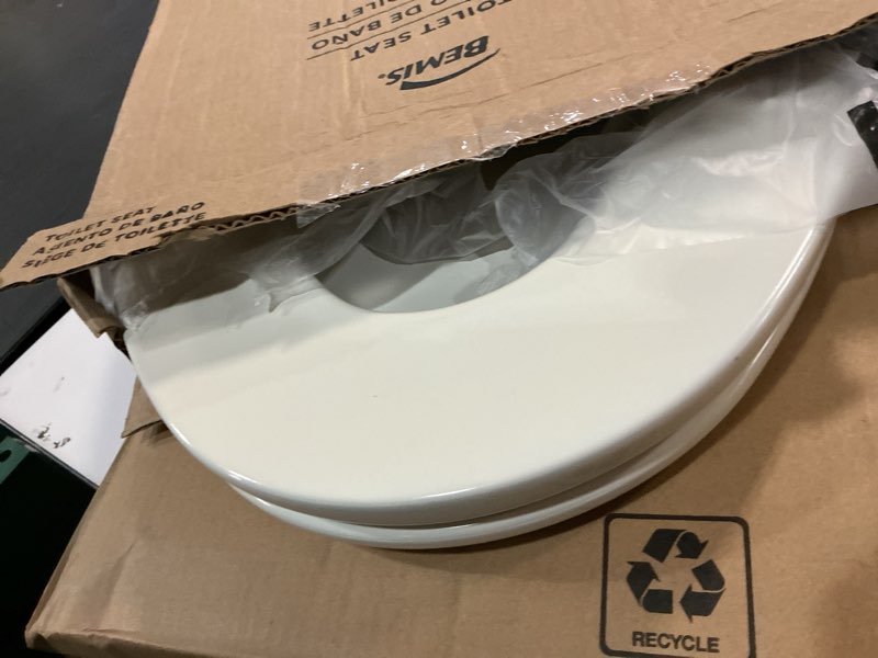 Condition photo showing As Is for Bemis Elongated Enameled Wood Toilet Seat in Biscuit with Easy•Clean? Hinge