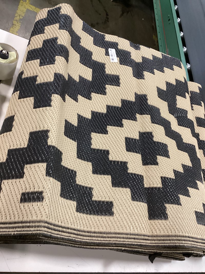 Condition photo showing New/Like New for smiry waterproof outdoor rug 5x8 ft, reversible plastic straw patio camping rugs, outdoor indoor rv mat carpet for patio, outside entry, backyard, deck, bench, picnic, camper, black & beige black and beige 5' x 8' (rectangular)