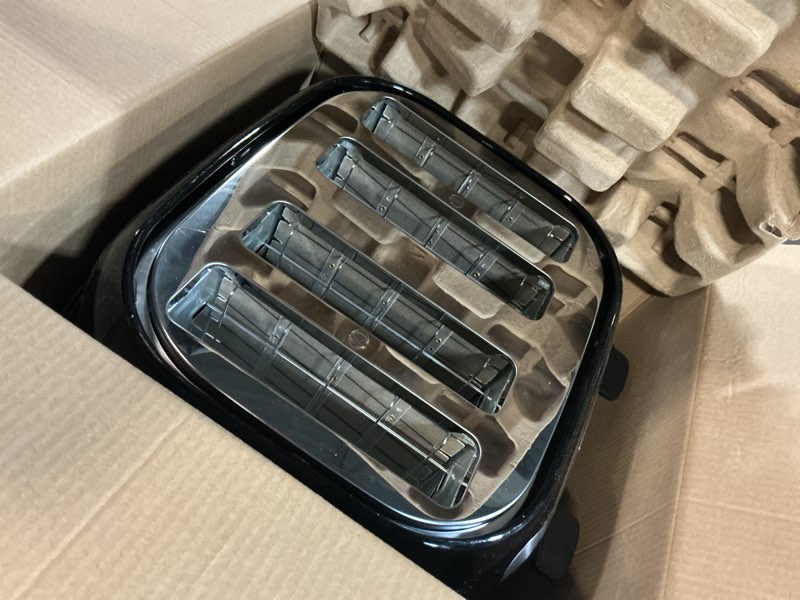 Condition photo showing As Is for black+decker 4-slice toaster, extra wide slots, 7 shade settings, 1400 watts, frozen and bagel buttons, toast shade selector, extra lift