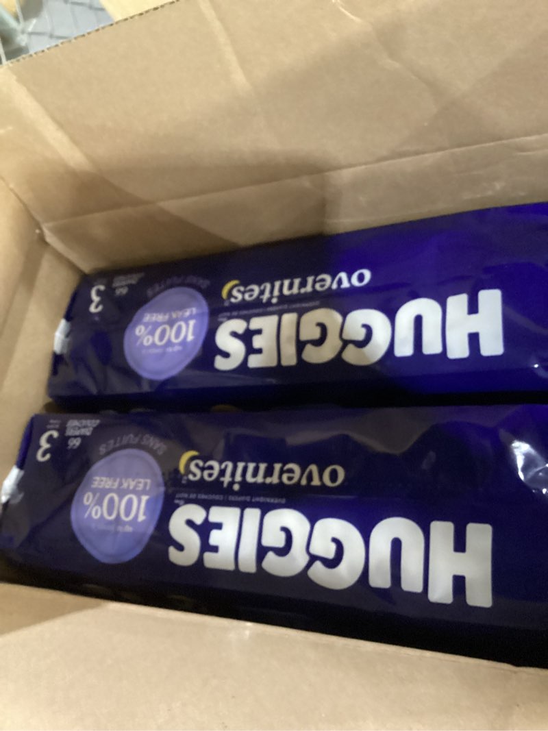 Condition photo showing New/Like New for Huggies overnites size 3 132 diapers