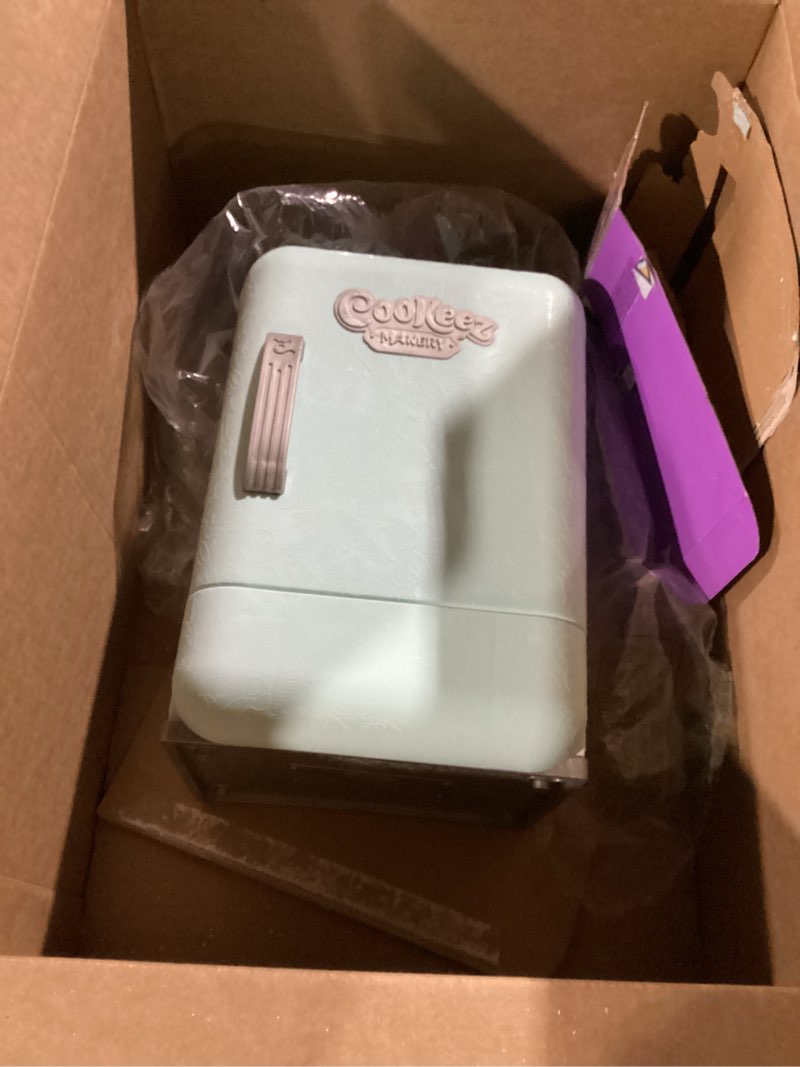 Condition photo showing As Is for cookeez makery freezy cakez. mix & decorate your plush best friend! place your cake mix in the freeze and be amazed when a scented, shivering, interactive plush friend comes out. styles may vary