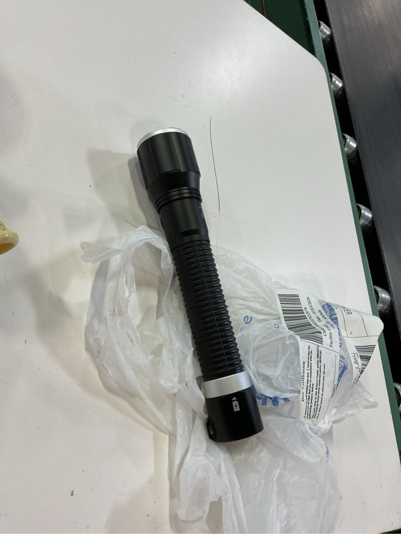Condition photo showing As Is for 8,000 lumen dual power flashlight