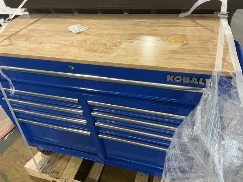 Condition photo showing As Is for Kobalt 46.1-in L x 37.2-in H 9 -Drawers Rolling Blue Wood Work Bench