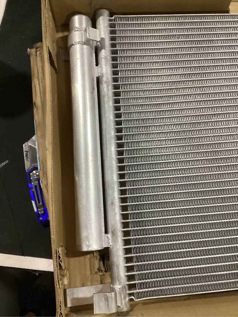 Condition photo showing As Is for automotive ac condenser