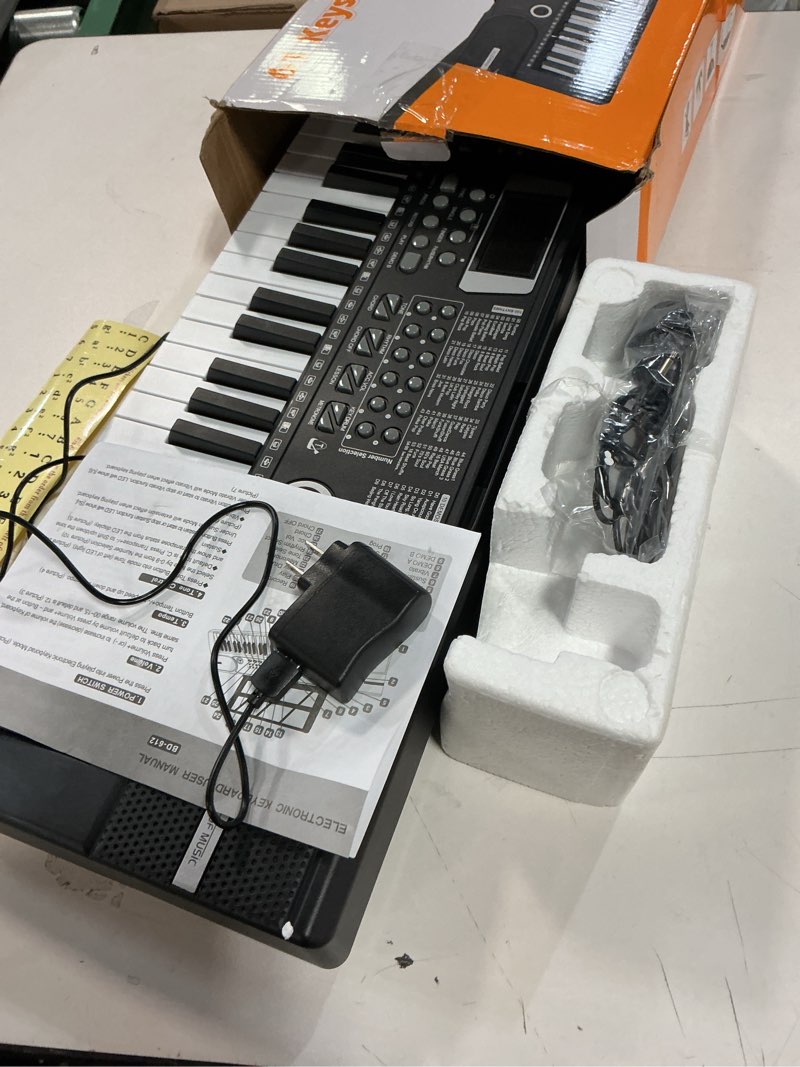 Condition photo showing Good Condition for 61 keys keyboard piano, Electronic Digital Piano with Built-In Speaker Microphone, Sheet Stand and Power Supply, Portable piano Keyboard Gift Teaching for Beginners Black