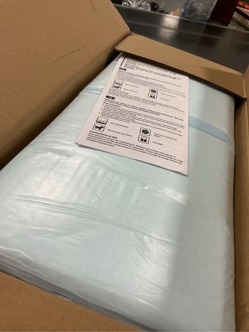 Condition photo showing New/Like New for Amazon Basics Dog and Puppy Pee Pads with 5-Layer Leak-Proof Design and Quick-Dry Surface for Potty Training, Standard Absorbency, X-Large, 28 x 34 Inch - Pack of 60, Blue & White X-Large (60 Count)