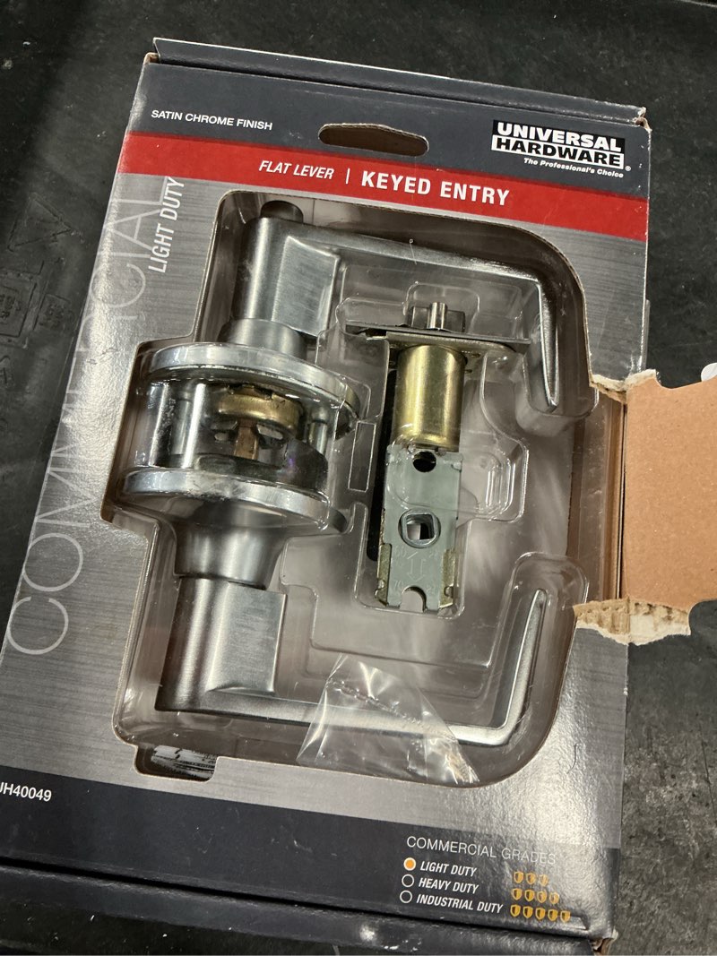 Condition photo showing As Is for universal hardware light duty commercial entry lever ada, ul 3-hr fire, ansi grade 2, satin chrome finish